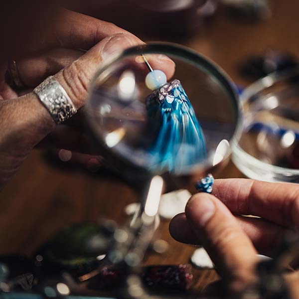 Woman making handmade jewelry